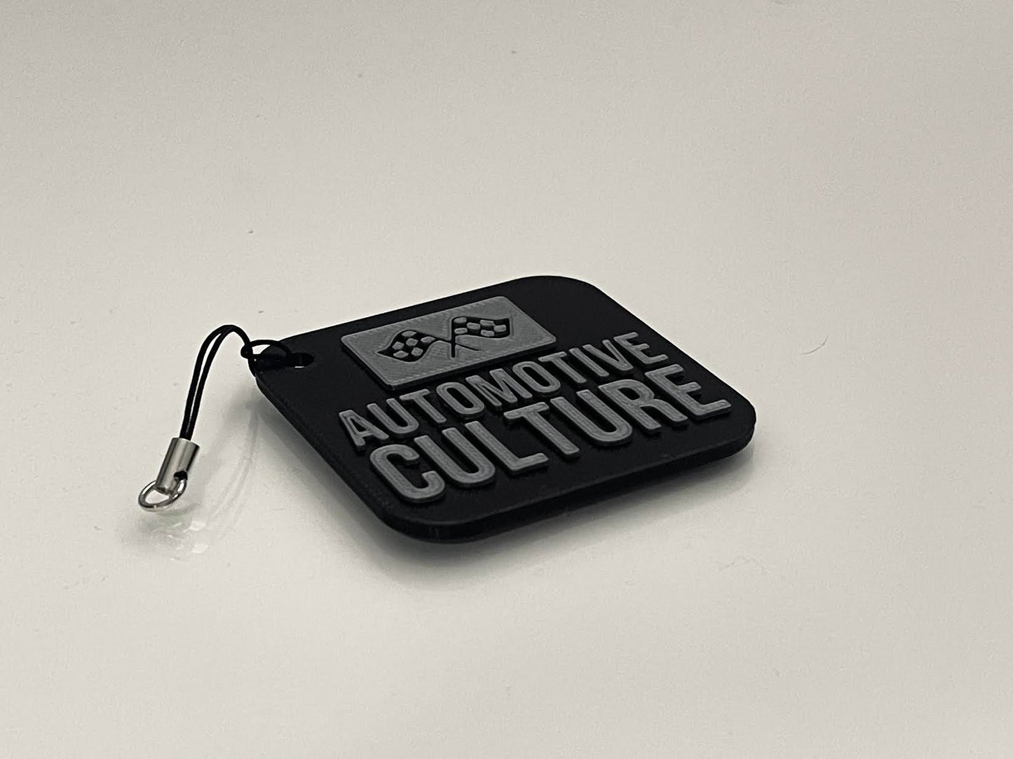 Automotive Culture logo keychain, sleek ABS design, perfect accessory for car enthusiasts.