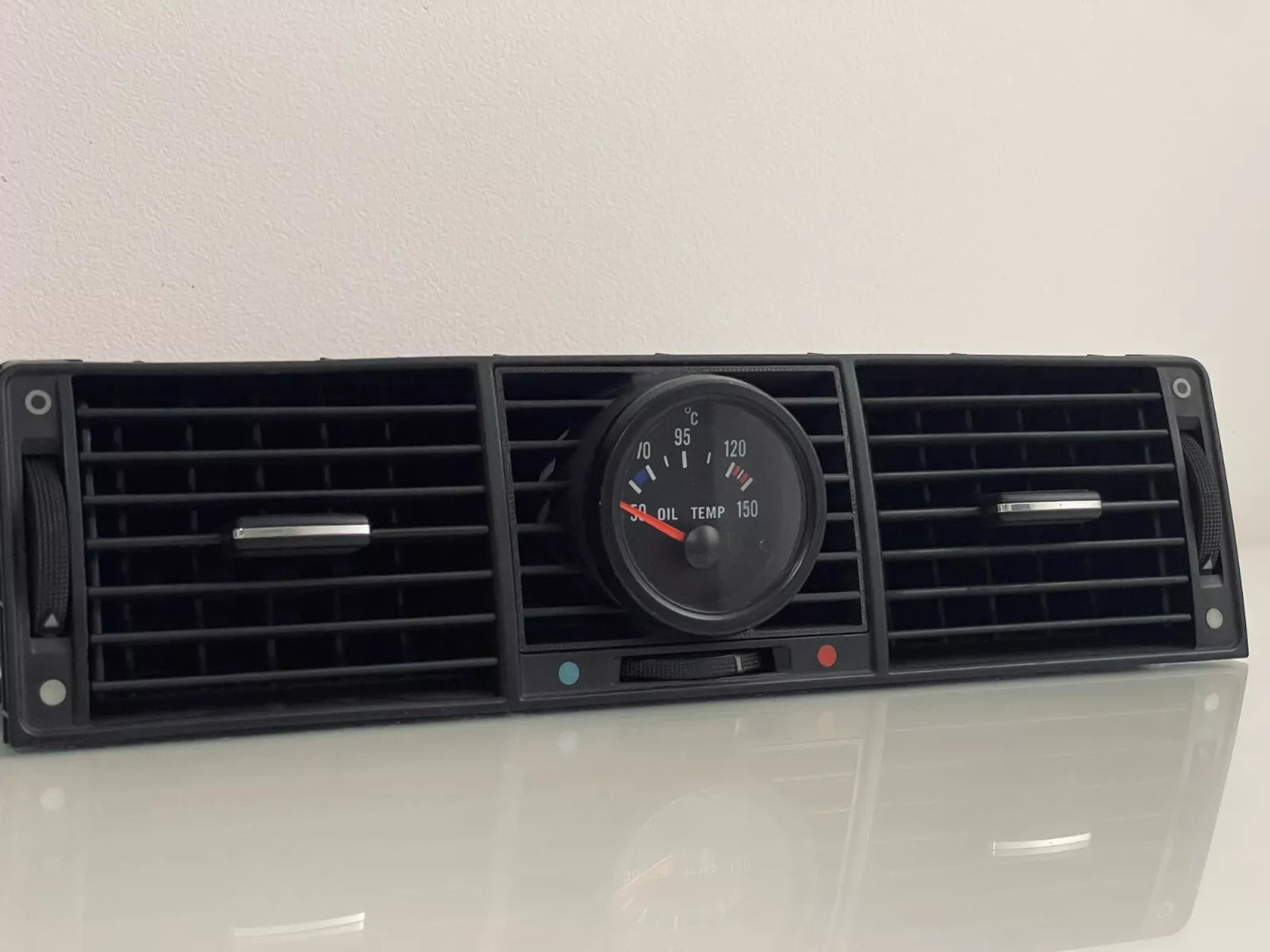 Audi A8/S8 D2 Center Gauge Pod installed in center air vent - wide shot showing dashboard integration