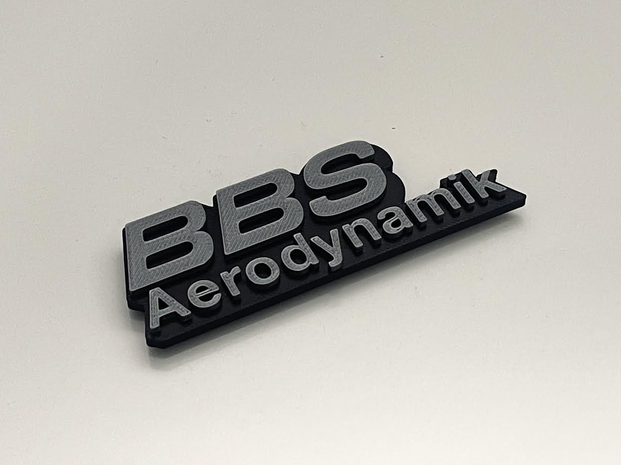 BBS Aerodynamik Emblem in silver - front view with high-quality finish