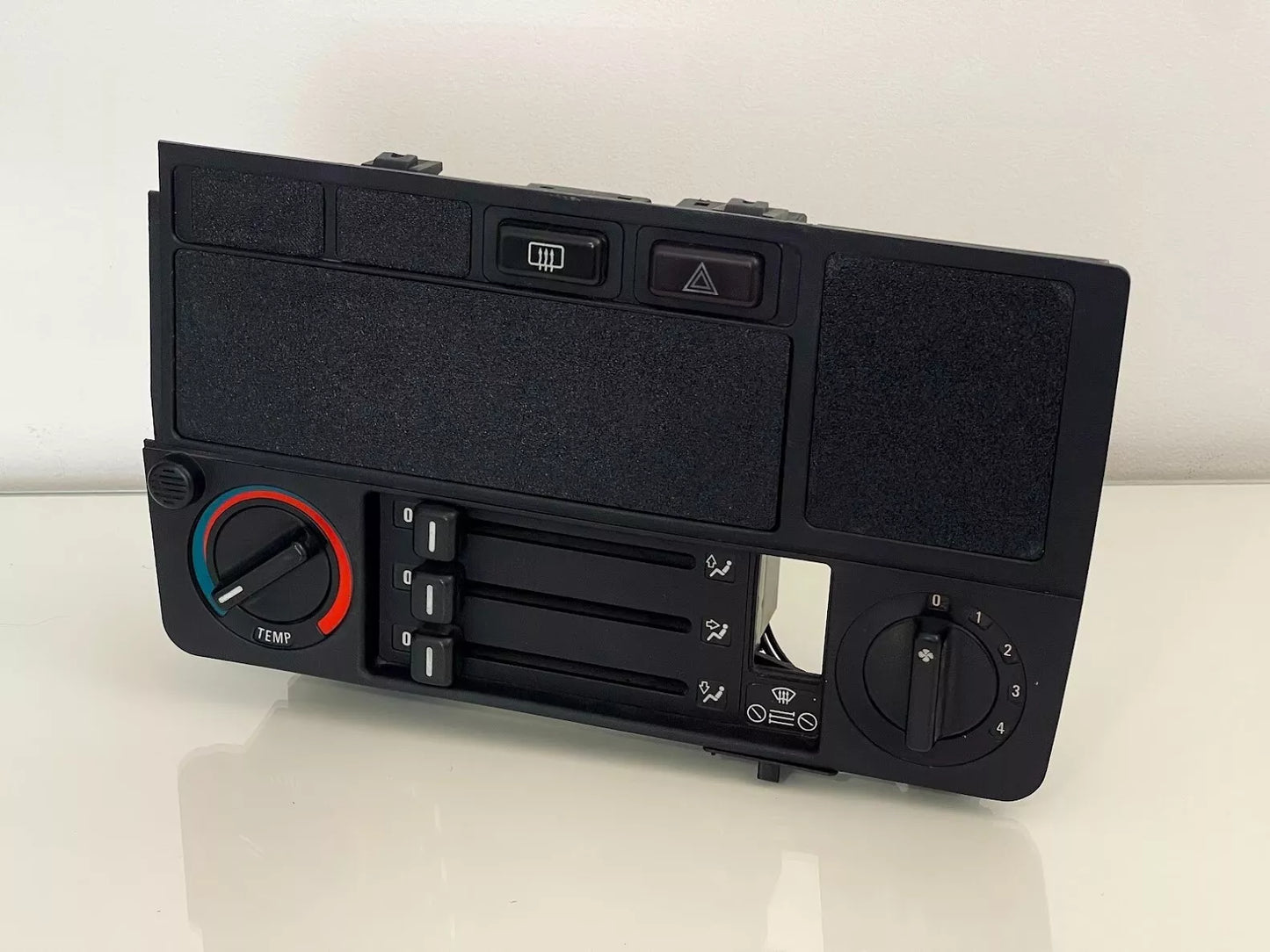 BMW E30 HVAC Blank Panel Kit installed in dashboard covering radio, OBC, and buttons