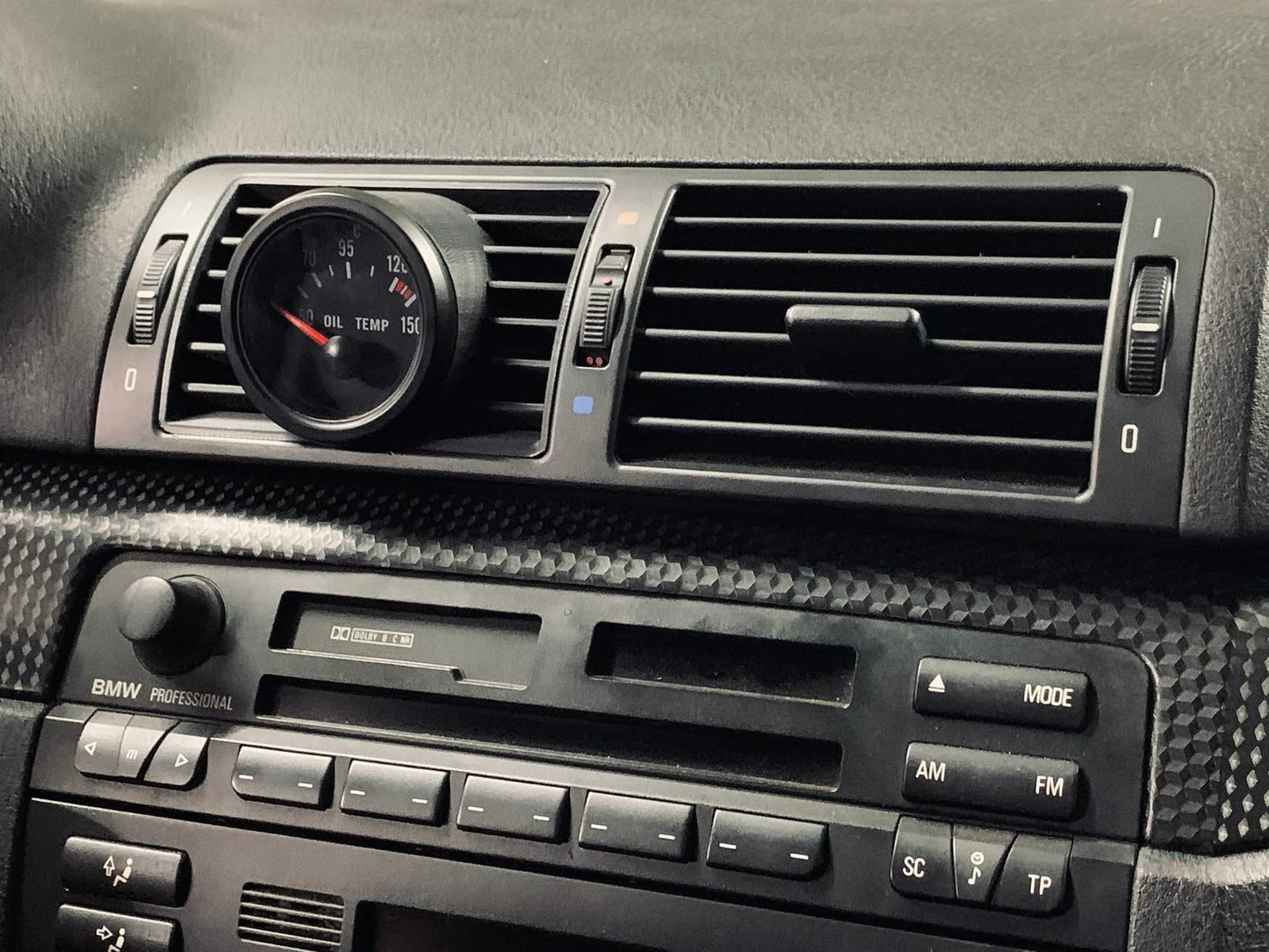 BMW E46 Center Gauge Pod installed in center air vent - wide shot showing dashboard integration