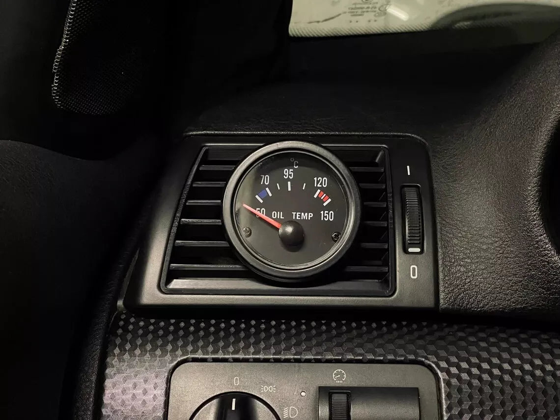 Front view of BMW E46 Driver Side Gauge Pod installed in driver side air vent
