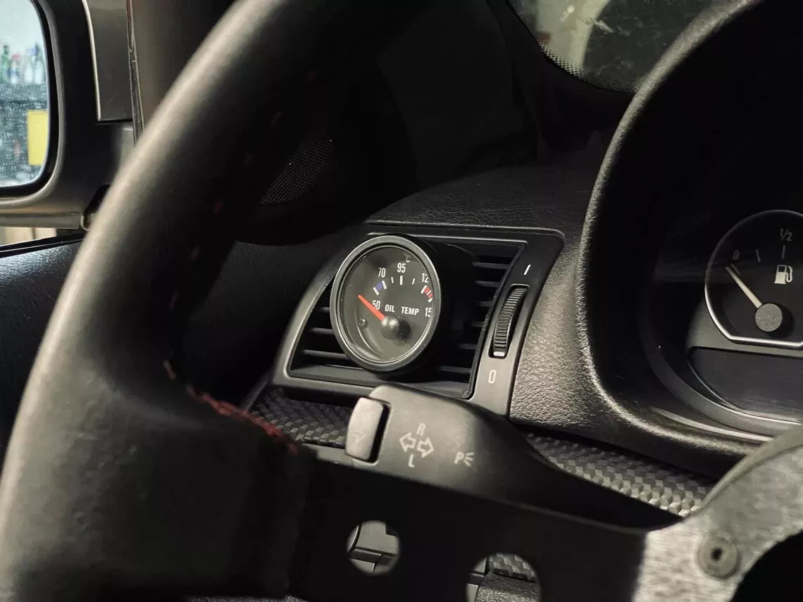 BMW E46 Driver Side Gauge Pod installed in driver side air vent - wide shot showing dashboard integration