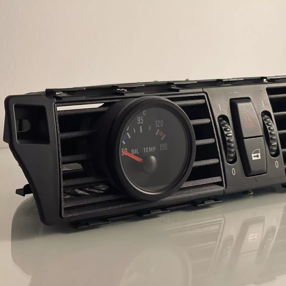 Close-up of BMW E60 Center Gauge Pod installed in center air vent