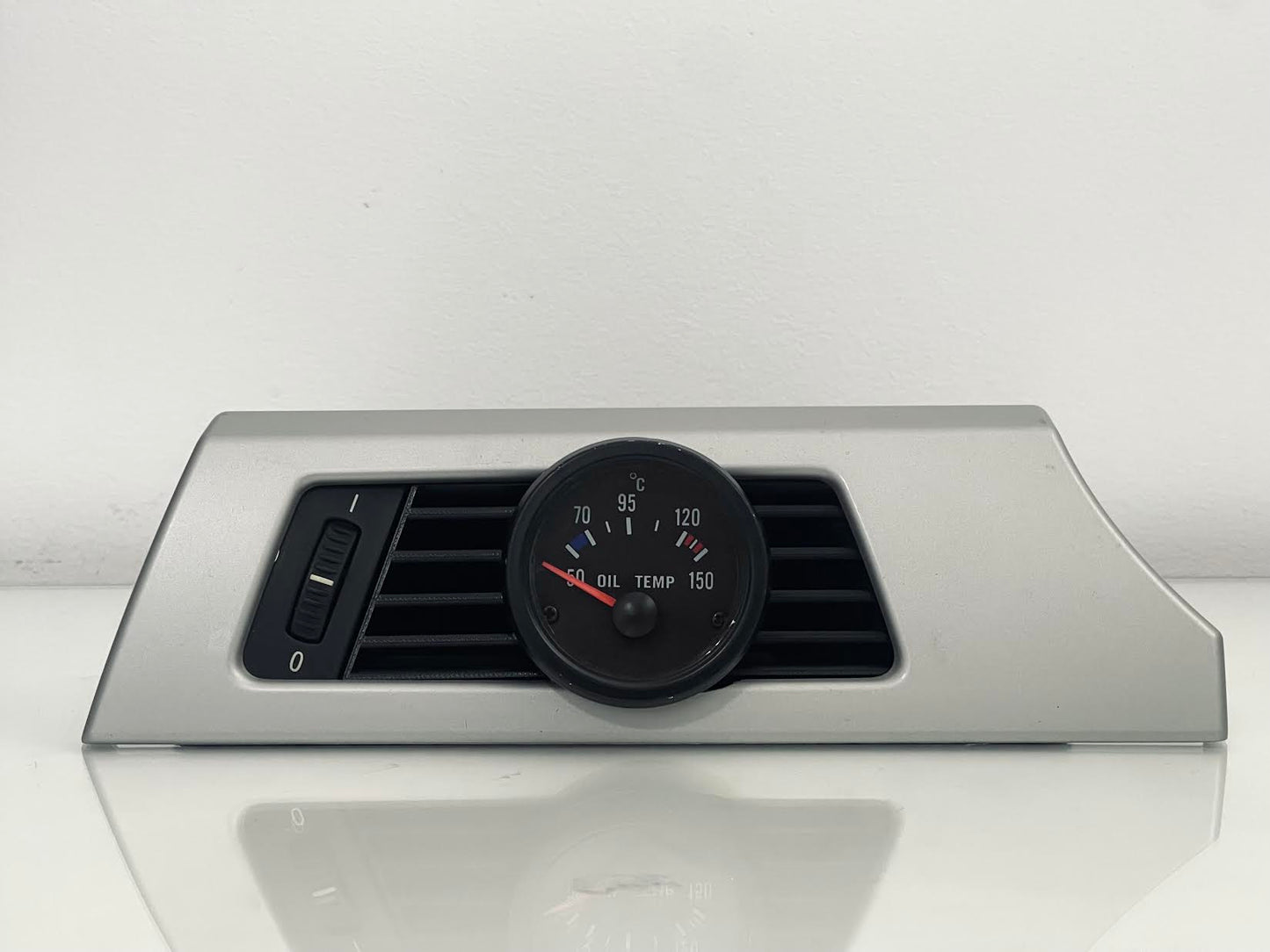 BMW E90 Driver Side Gauge Pod installed in driver side air vent - wide shot showing dashboard integration