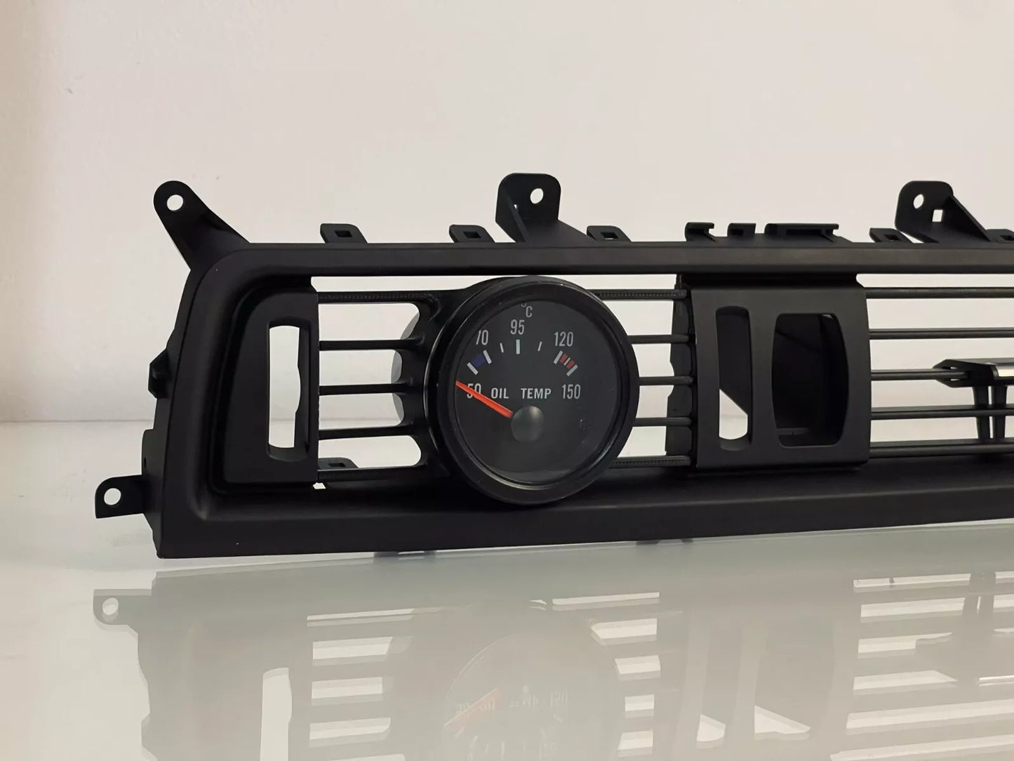 BMW F10 Center Gauge Pod installed in center air vent - wide shot showing dashboard integration