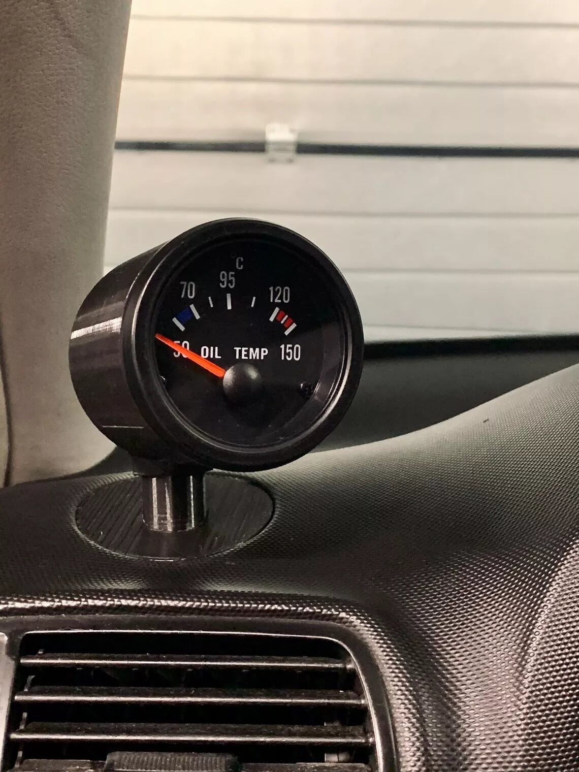 Close-up of Seat Leon MK1 Defrost Vent Gauge Pod installed in dashboard vent