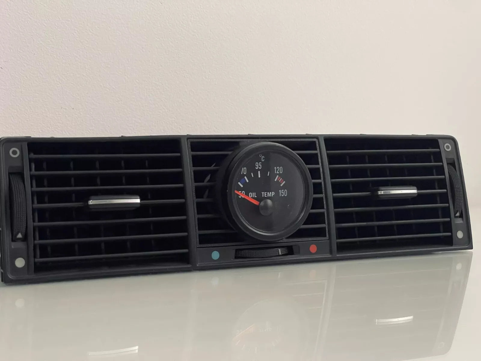 Audi A8/S8 D2 Center Gauge Pod installed in center air vent - wide shot showing dashboard integration