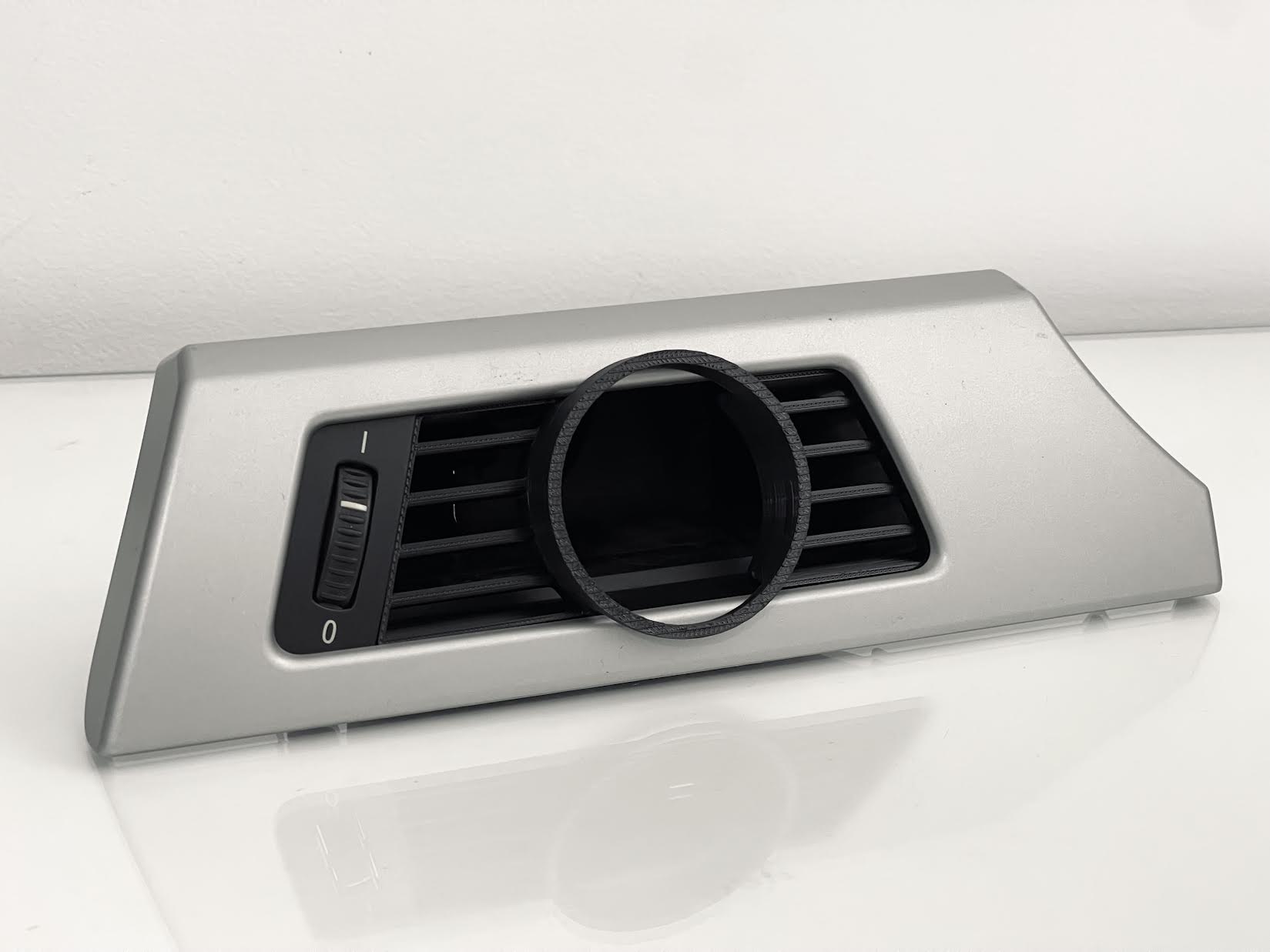 Close-up of BMW E90 Driver Side Gauge Pod installed in driver side air vent