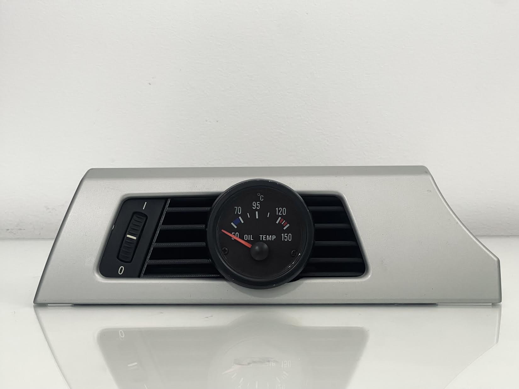 BMW E90 Driver Side Gauge Pod installed in driver side air vent - wide shot showing dashboard integration